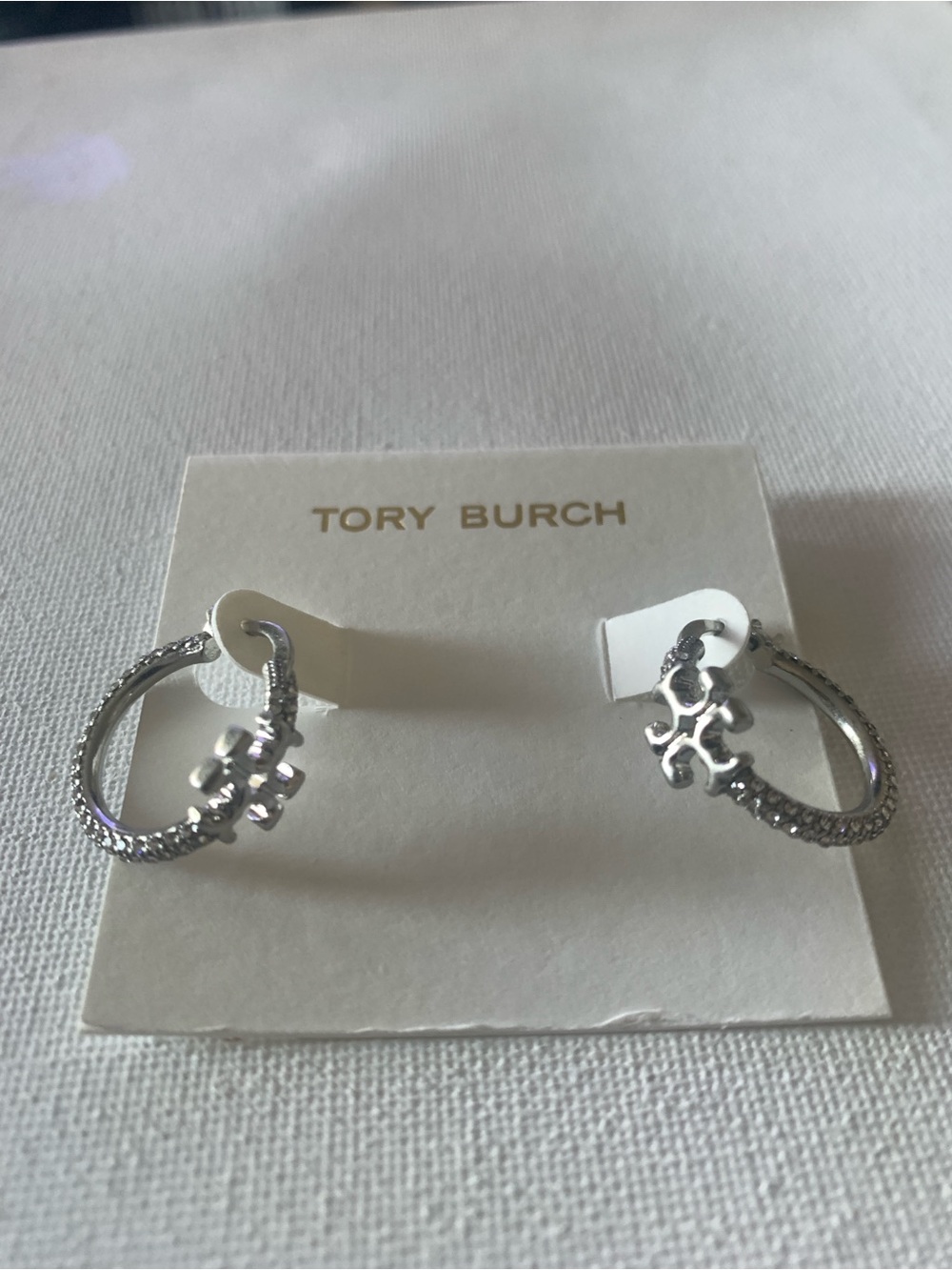Tory Burch Silver Textured Hoop Earrings with Logo Charm